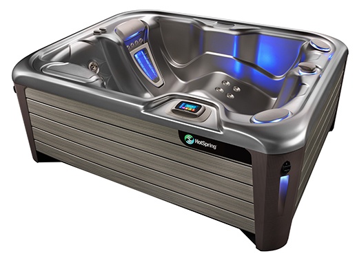 a highlife nxt jetsetter hot tub with a platinum colored shell and deep blue interior lighting